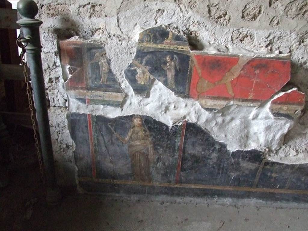 VI.15.1 House of the Vettii. R oom of the Cupids or Cherubs. Wall painting. Above wall painting of three Psychai gathering flowers. Below is a female figure or priestess holding implements of sacrifice.