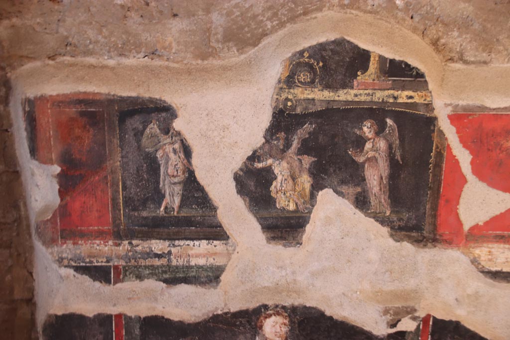 VI.15.1 Pompeii. October 2023.
West wall at south end, detail of wall painting from predella of three Psychai gathering flowers. Photo courtesy of Klaus Heese.