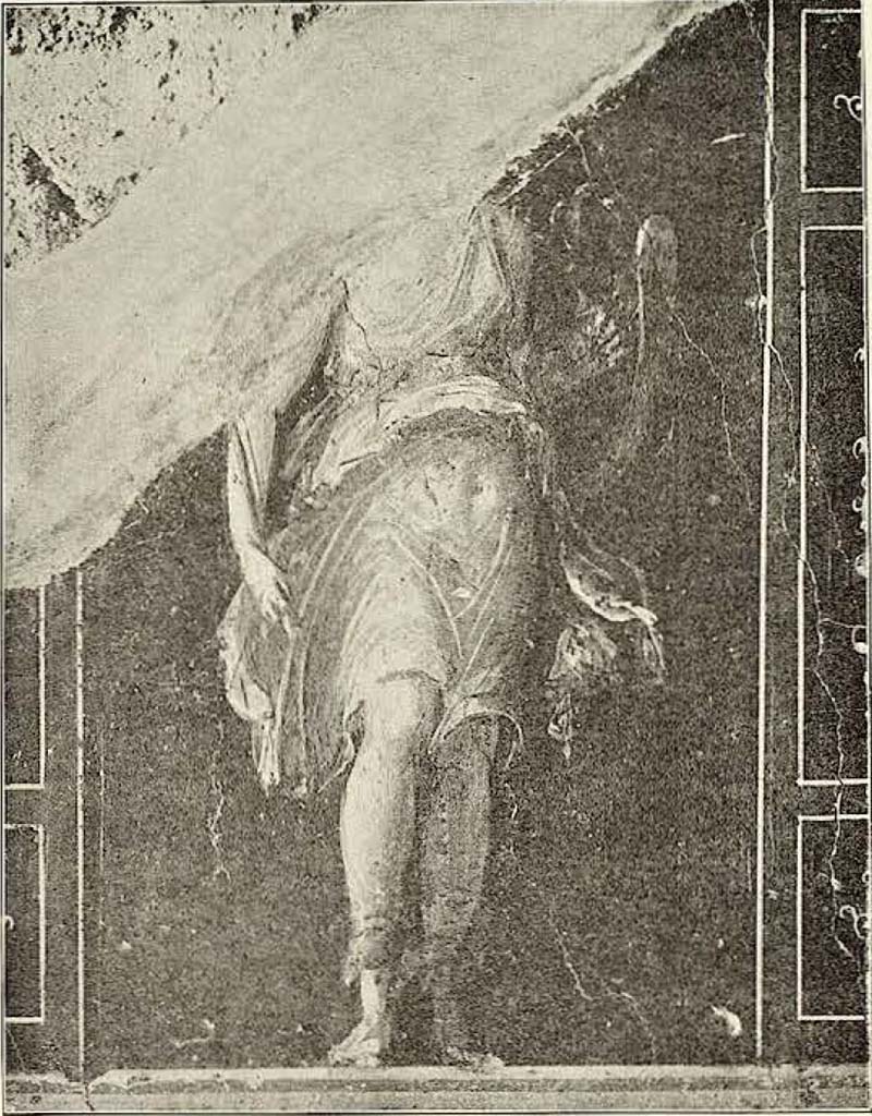VI.15.1 Pompeii. Painted panel on zoccolo (0.44 high remaining) from centre of west wall.
Described by Sogliano as –
“Danneggiata nella testa e nelle spalle.
Amazzone fieramente piantata: indossa corta veste gialla orlata di celeste chiaro, con mantello grigio, ed ha i piedi muniti di coturni grigi.
Nella destra abbassata tiene la scure e al braccio sinistro lo scudo.”
(Damaged in the head and shoulders.
Proud Amazon: wearing a short yellow robe edged with light blue, with a grey cloak, and feet fitted with grey half-boots.
Holding in the right hand an axe, and in the left arm a shield.)
See Sogliano, A. La Casa dei Vettii in Pompei Mon. Ant. 1898. (p.371-372, fig. 62).
