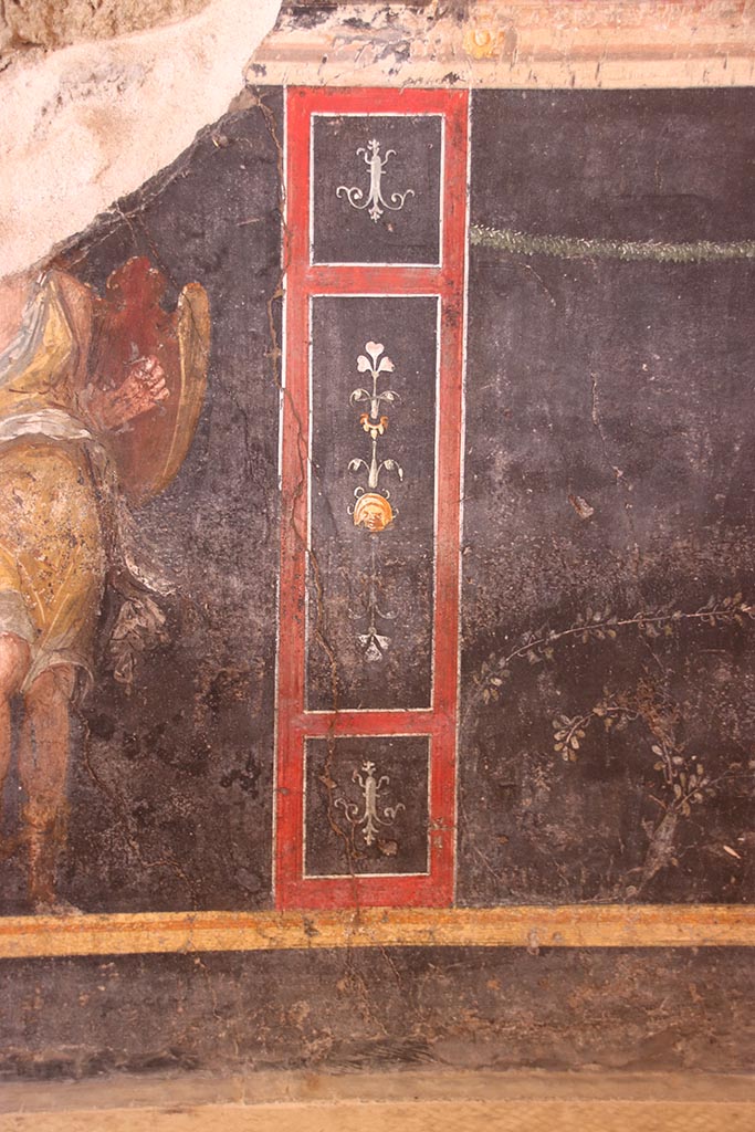 VI.15.1 Pompeii. October 2024.
Lower west wall with painted decoration on zoccolo. Photo courtesy of Klaus Heese.