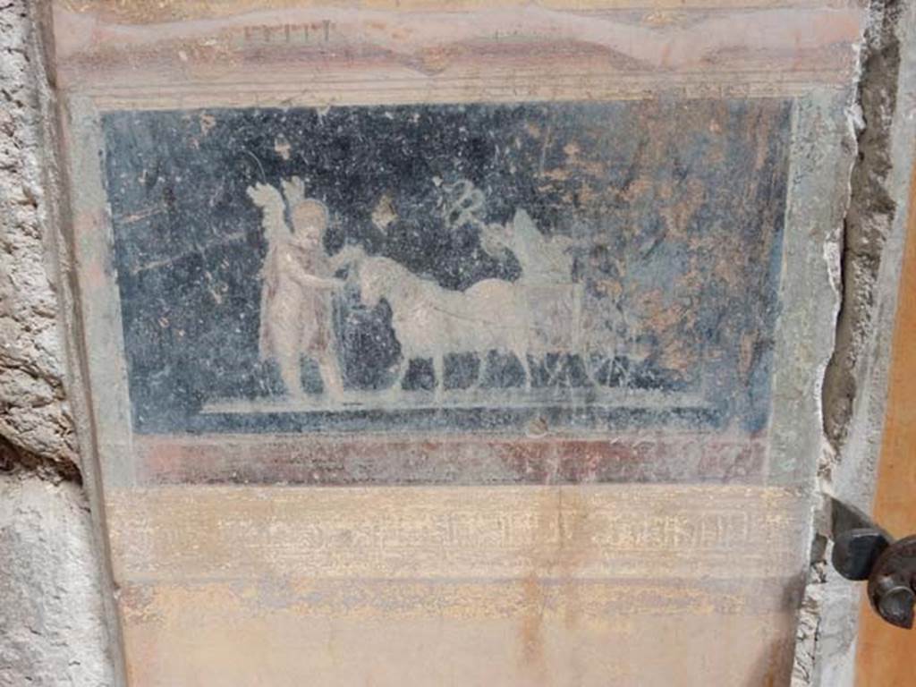 VI.15.1 Pompeii. May 2017. Painted panel on atrium wall between doorways. Photo courtesy of Buzz Ferebee.