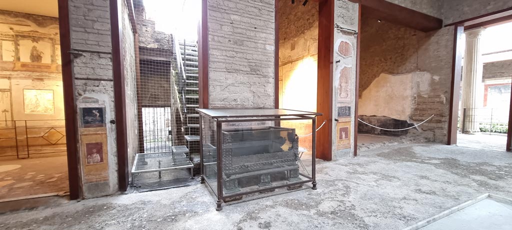 VI.15.1 Pompeii. January 2023.
Looking south across atrium with strongbox/money box/safe, in centre.
The statue of Priapus in the south ala, on the right, has been moved to the peristyle. Photo courtesy of Miriam Colomer.