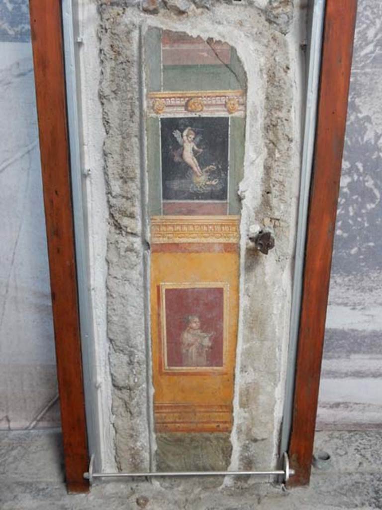 VI.15.1 Pompeii. May 2017.
Detail of painted panel on south end of west wall of atrium, leading onto peristyle. Photo courtesy of Buzz Ferebee.