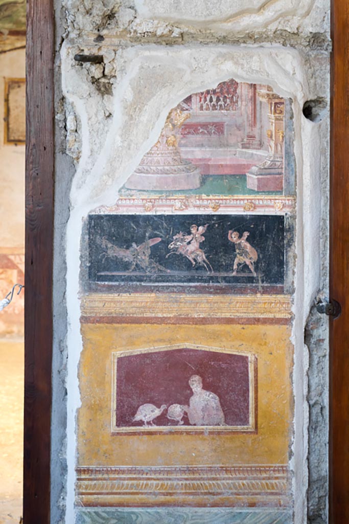 VI.15.1 Pompeii. March 2023.
Painted panels in atrium between doorways to bedroom on left of main entrance and oecus on south side.
Photo courtesy of Johannes Eber.