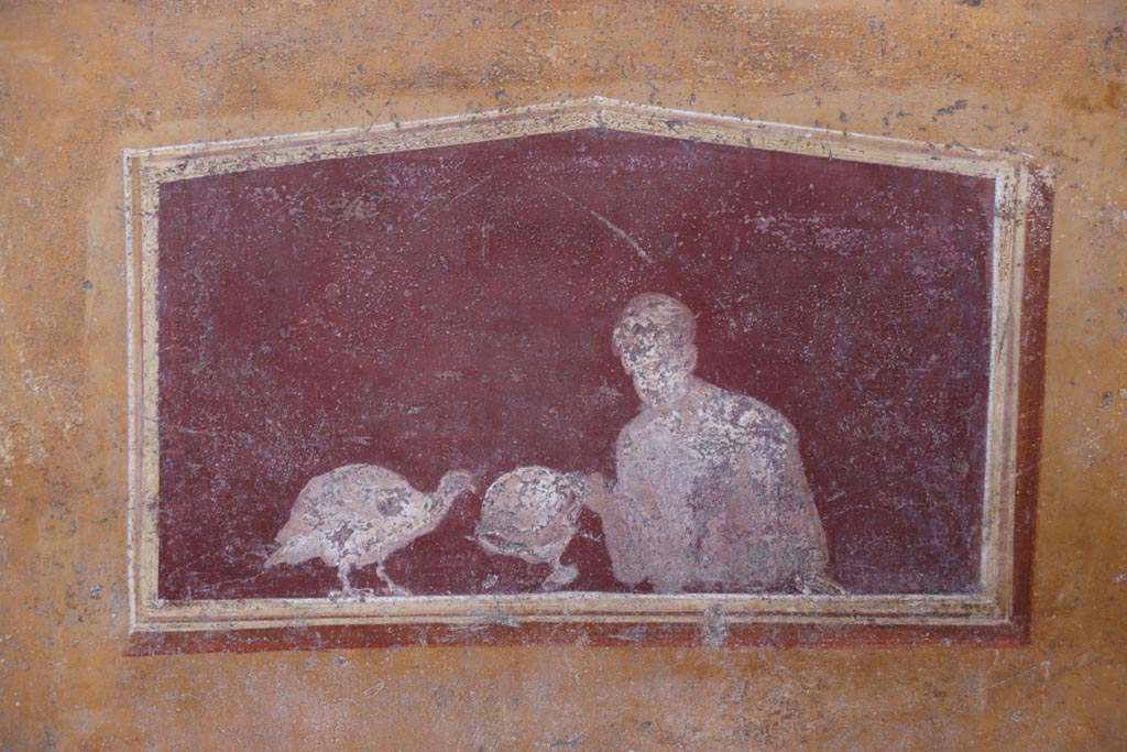 VI.15.1 Pompeii. October 2023.
East wall of atrium, detail of lower painted panel between cubiculum (d) and oecus (e). Photo courtesy of Klaus Heese.