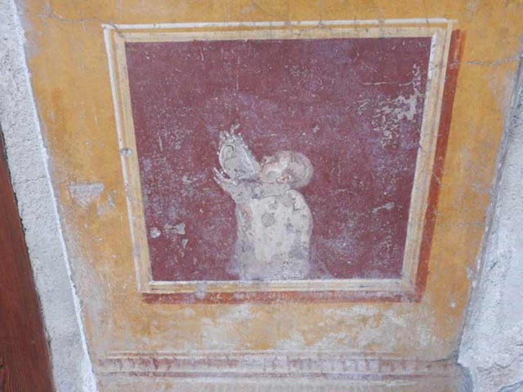 VI.15.1 Pompeii. May 2017. South side of atrium, decorative painting between doorways. Photo courtesy of Buzz Ferebee.