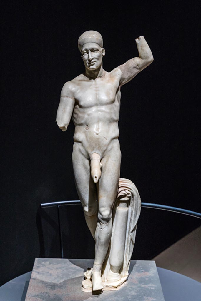 VI.15.1 Pompeii. March 2023.
Statue of Priapus, on display in exhibition in Palaestra. Photo courtesy of Johannes Eber.