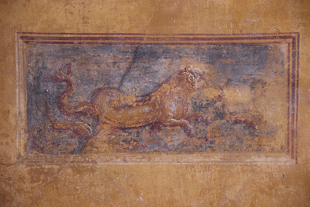 VI.15.1 Pompeii. October 2024.
Detail from painted panel on south wall at east end in south-east corner of exedra. Photo courtesy of Klaus Heese.