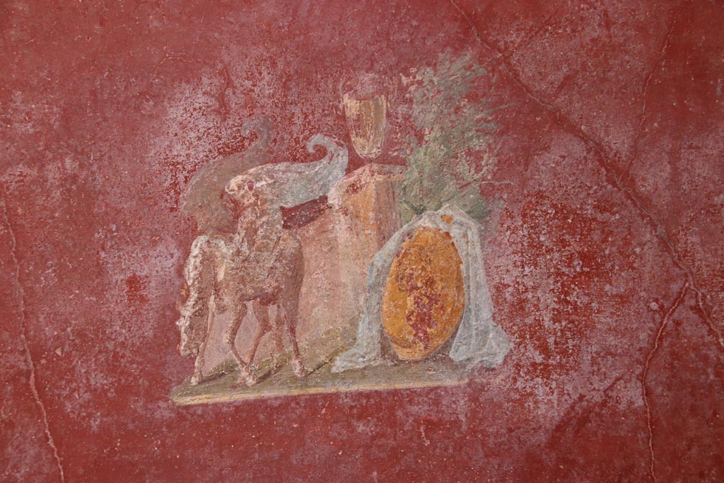 VI.15.1 Pompeii. October 2023.
North wall of small courtyard/peristyle garden “s”, detail from central panel. Photo courtesy of Klaus Heese.