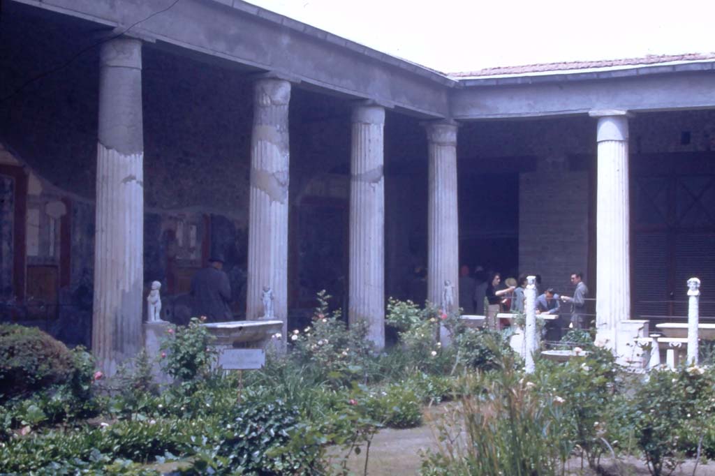VI.15.1 Pompeii. May 1953. Looking across peristyle towards north-west corner. Photo courtesy of Rick Bauer.