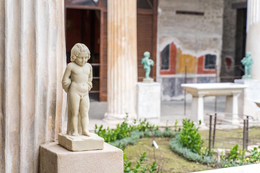 VI.15.1 Pompeii. March 2023. Statue on west side of peristyle, looking north-east. Photo courtesy of Johannes Eber.