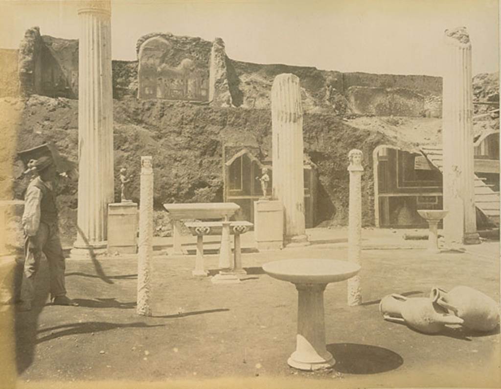 VI.15.1 Pompeii. Possibly 1894-95 during excavations. North end of peristyle garden showing ornaments in place, and upper floor (?). Photo courtesy of Rick Bauer.