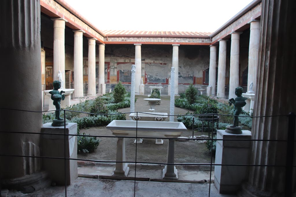 VI.15.1 Pompeii. October 2023.
Looking south across peristyle garden from north portico outside of the “Cupid’s room”. Photo courtesy of Klaus Heese.