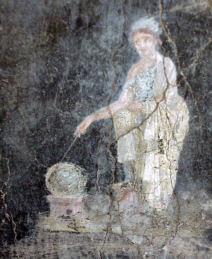 VI.15.1 Pompeii. October 2001.
North-east corner, painting from north side of east portico between doorway to exedra and window to ala.
Painted panel on black background of Urania in green robe with white fringed cloak, with her head surrounded by a crown of feathers, pointing with a stick to the globe resting on a square base. Photo courtesy of Peter Woods.