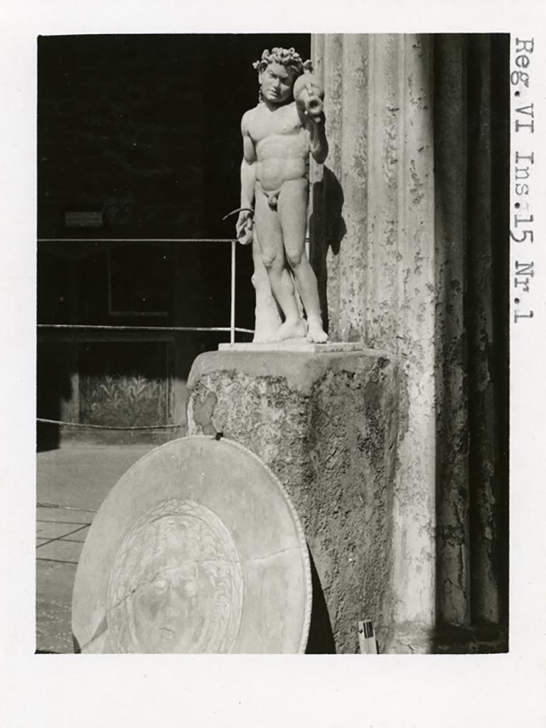 VI.15.1 Pompeii. Pre-1937-39. Looking towards north-east corner with marble statuette.
Photo courtesy of American Academy in Rome, Photographic Archive. Warsher collection no. 1389.