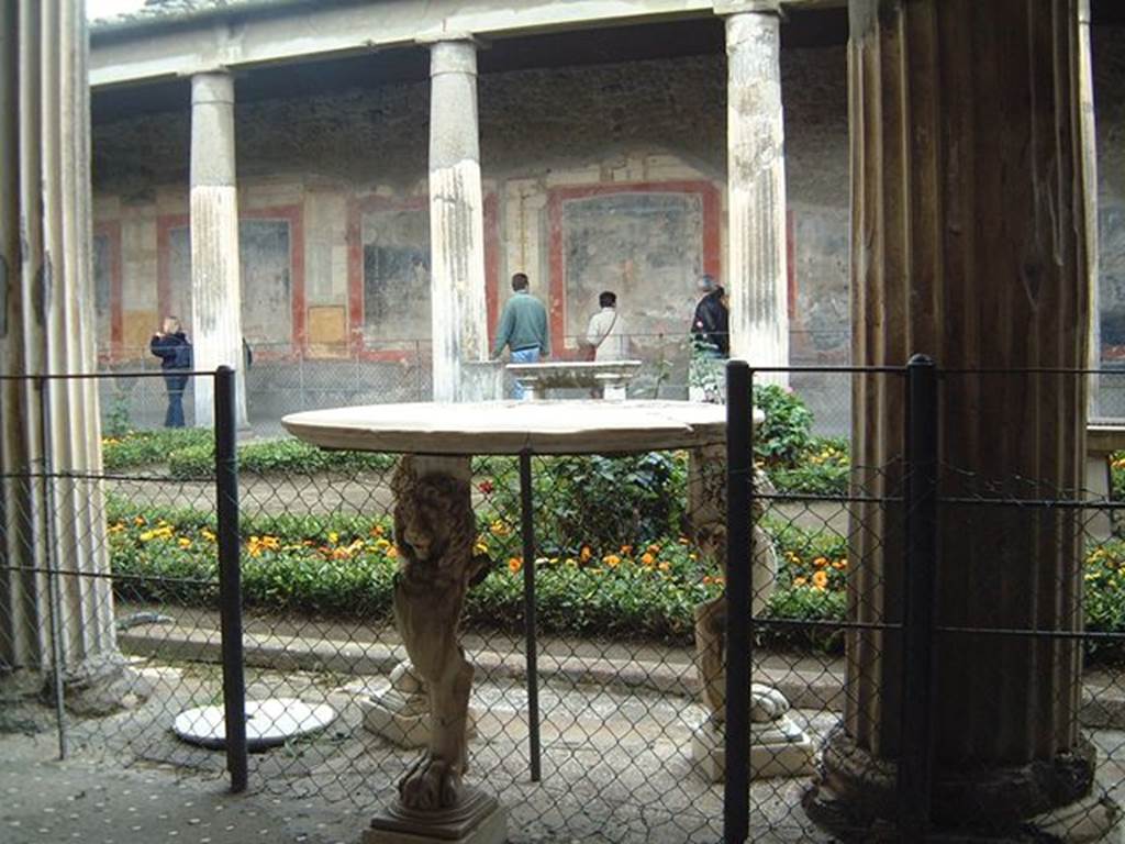 VI.15.1 Pompeii. December 2006. Table with three lion legs in peristyle.