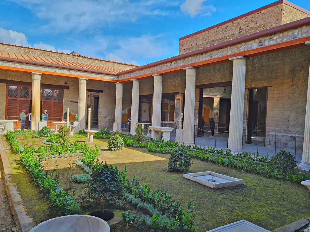 VI.15.1 Pompeii. April 2023.
Looking north-east across peristyle towards doorway to atrium, centre right. Photo courtesy of Giuseppe Ciaramella.