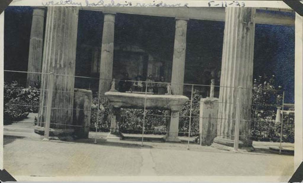 VI.15.1 Pompeii. May 1923 photograph. Looking west across peristyle from east portico.
Photo courtesy of Rick Bauer.