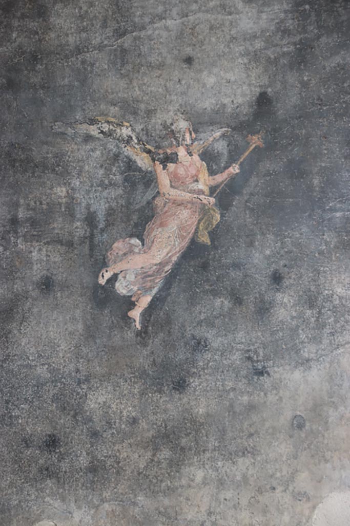 VI.15.1 Pompeii. October 2023.
Painted figure from centre of panel on south wall of peristyle. Photo courtesy of Klaus Heese.
