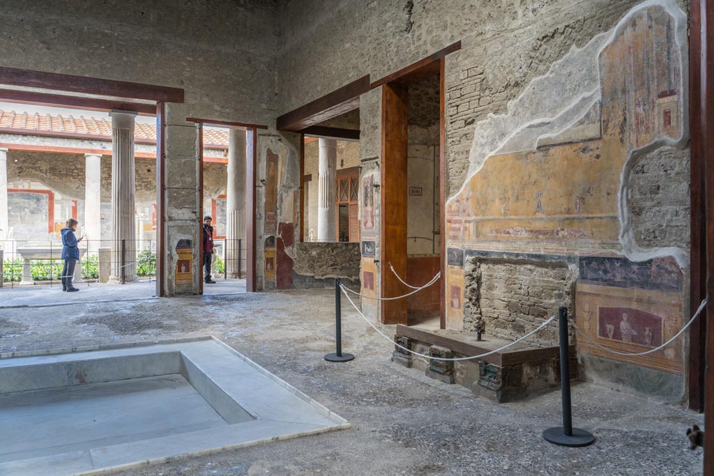 VI.15.1 Pompeii. March 2023.
Looking north-west across impluvium in atrium from east end near entrance doorway. Photo courtesy of Johannes Eber.