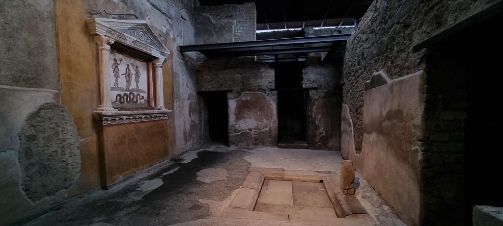 VI.15.1 Pompeii. January 2023.
Looking north from doorway in atrium into “services area”, kitchen etc, with lararium, on left, and an impluvium, centre right.
Photo courtesy of Miriam Colomer.