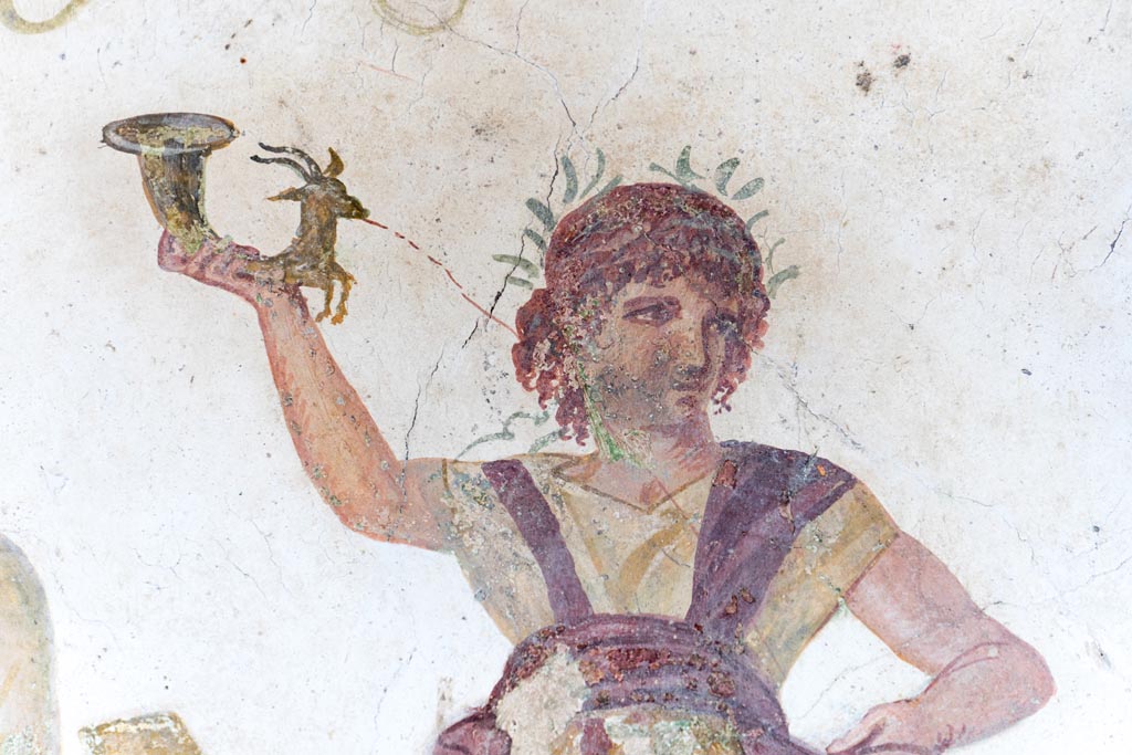 VI.15.1 Pompeii. August 2023.
Detail from lararium painting of wreathed Lar with rhyton, from north end of lararium painting. Photo courtesy of Johannes Eber.