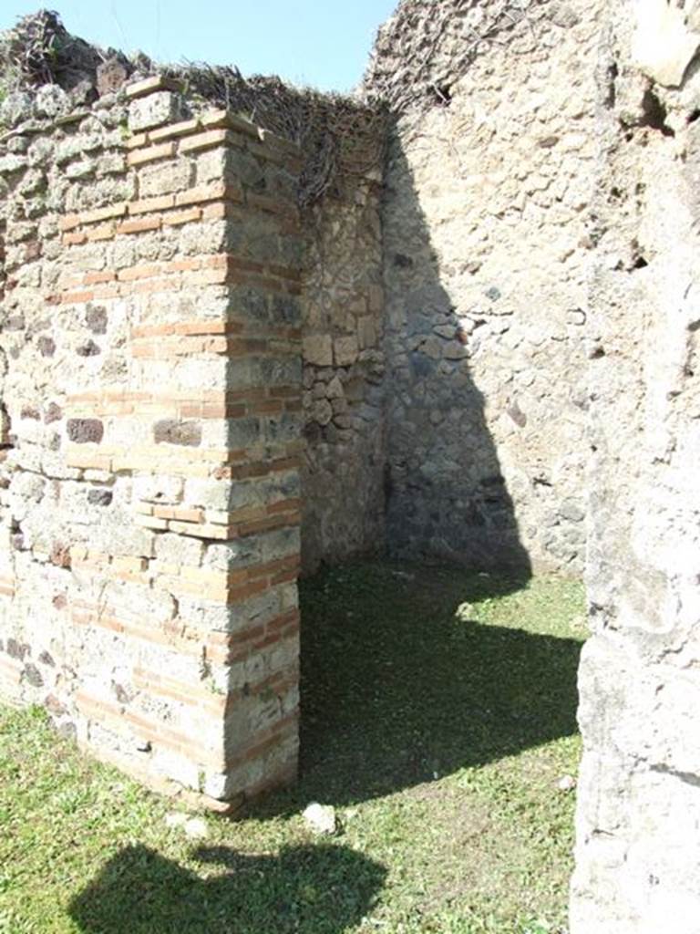 VI.15.5 Pompeii. March 2009.
Doorway to room 5, cubiculum, looking towards north-west corner.
This doorway would have had a wooden doorstep.