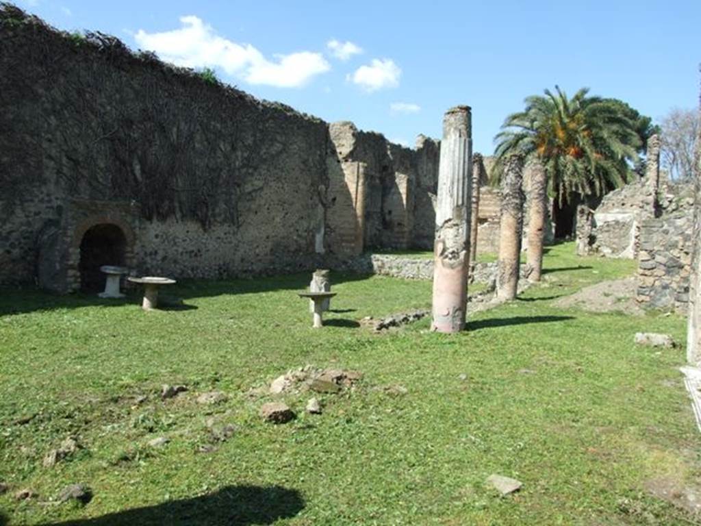 VI.15.5 Pompeii. March 2009. Garden area 11, looking north-west from east portico, room 12. According to Jashemski, the garden was excavated in 1895-96, it was at the rear of the tablinum. It had a portico supported on the north by two brick pillars, on the east and part of the south by brick columns joined by a low masonry wall. See Jashemski, W. F., 1993. The Gardens of Pompeii, Volume II: Appendices. New York: Caratzas. (p.156).