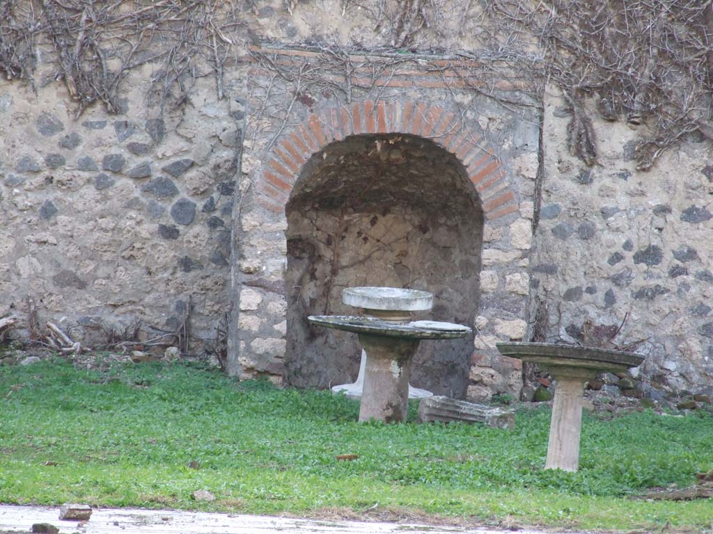 VI.15.5 Pompeii. December 2007. Looking west at tables in garden area.