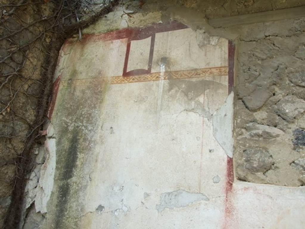 VI.15.5 Pompeii. March 2009. Room 22. Detail of painted decoration on west wall.