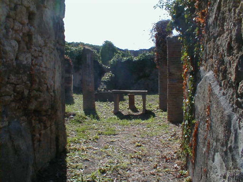 VI.15.6 Pompeii. September 2004. Looking west across atrium, from entrance fauces.
According to NdS, two bronze signet/seals were dug up in the atrium.
One had the name A. Caesi Valentis, and on the other was N. Herenni Nardi.
See Notizie degli Scavi di Antichità, January 1897, (p.30)