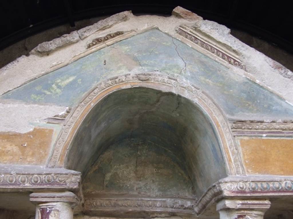 VI.15.8 Pompeii. December 2007. Detail of pediment and stucco on household shrine in the garden.