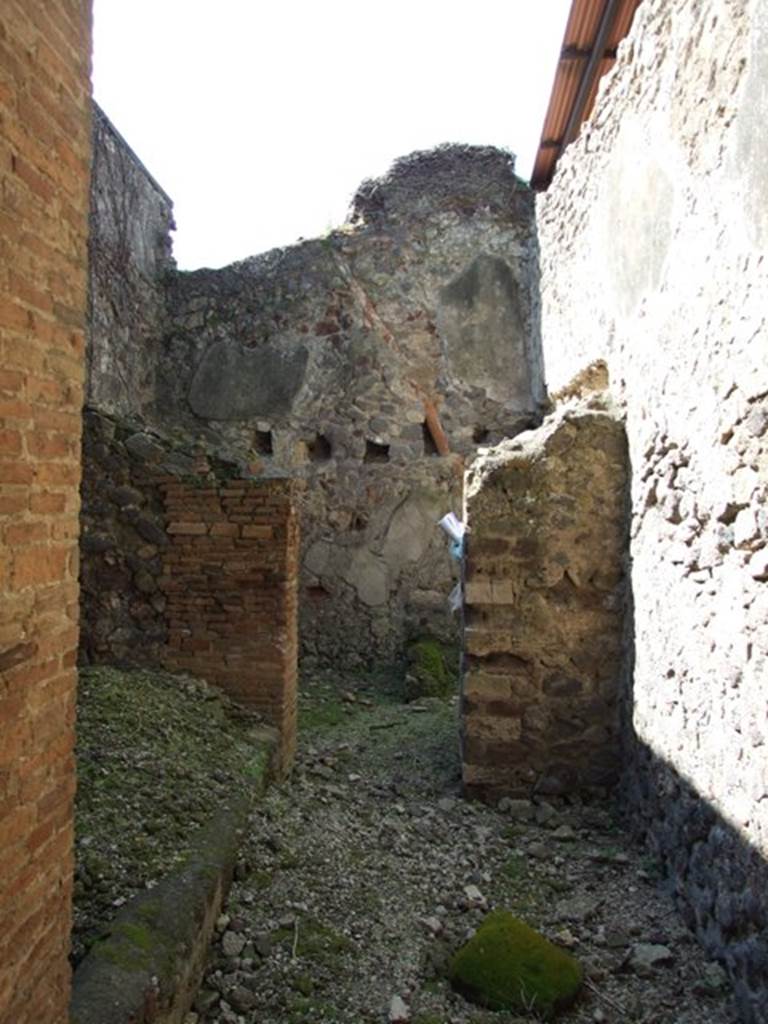 VI.15.9 Pompeii. March 2009. Services area, kitchen and latrine, with its own upper floor.
In left foreground, the light-well. According to NdS, ahead on the right from where you enter would have been the stairs to the upper floor. At the rear, would have been the latrine and a small hearth. See Notizie degli Scavi, February 1897, (p.64)