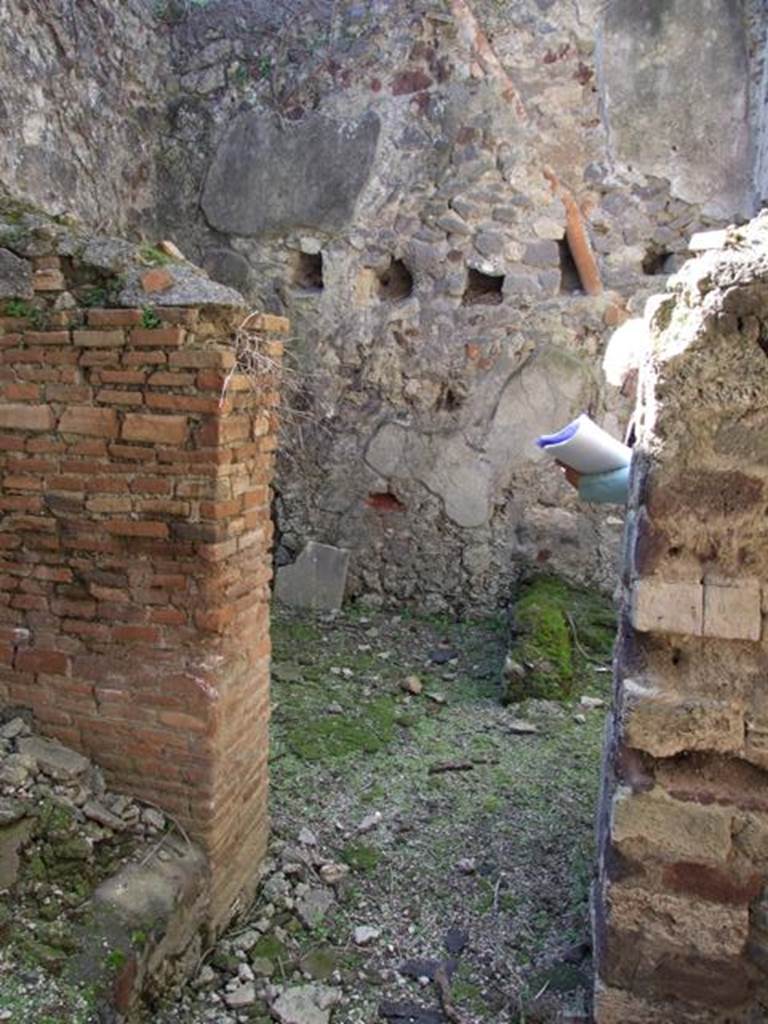 VI.15.9 Pompeii. March 2009. Kitchen area, doorway through to kitchen and latrine. Looking west.