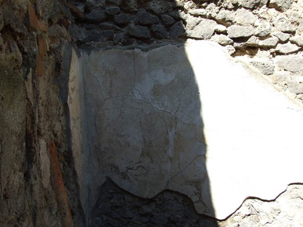 VI.15.9 Pompeii. March 2009. Latrine. North wall with remains of wall plaster.