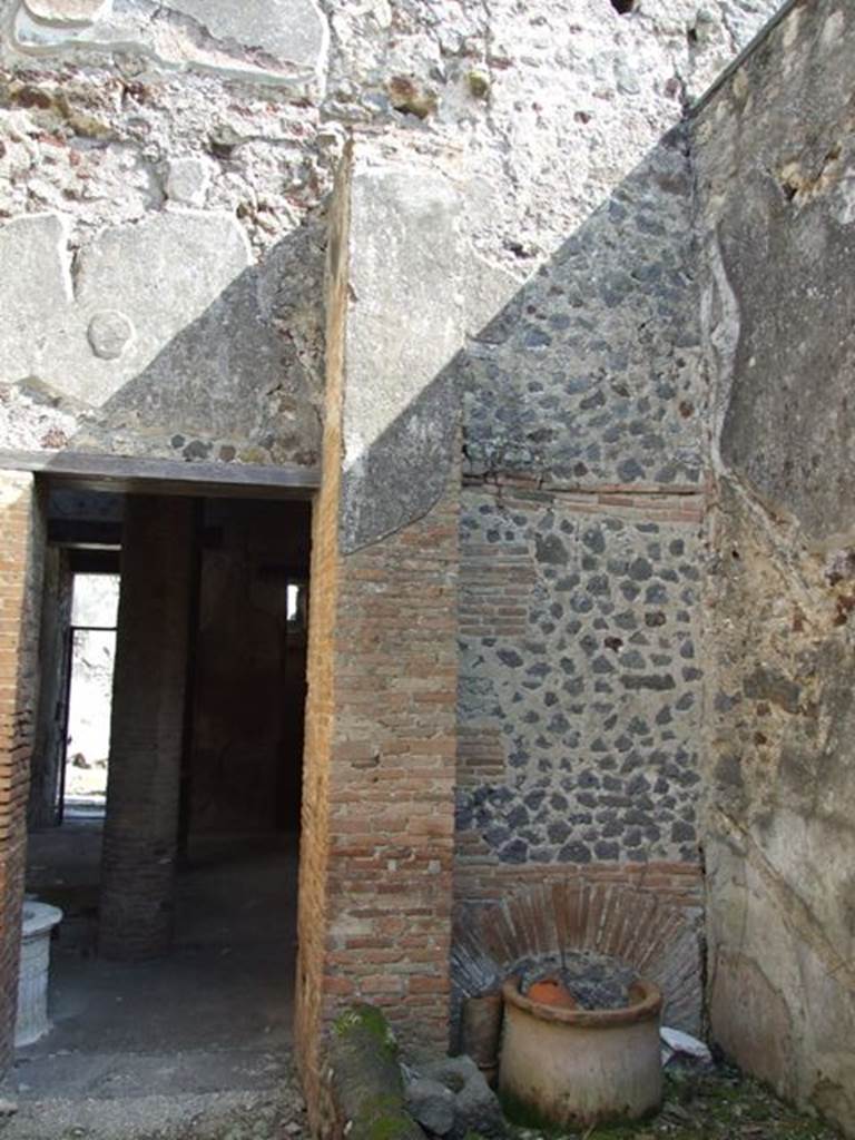 VI.15.9 Pompeii. March 2009. Roofless kitchen area looking east, walls with no holes for an upper floor.