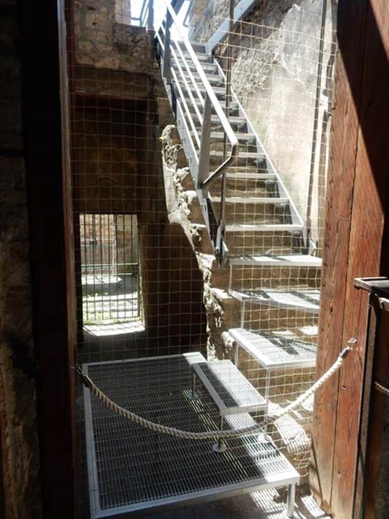 VI.15.27 Pompeii. May 2017.
Looking south from atrium of VI.15.1, towards room with steps to upper floor and corridor leading to stable entrance at VI.15.27.
Photo courtesy of Buzz Ferebee.