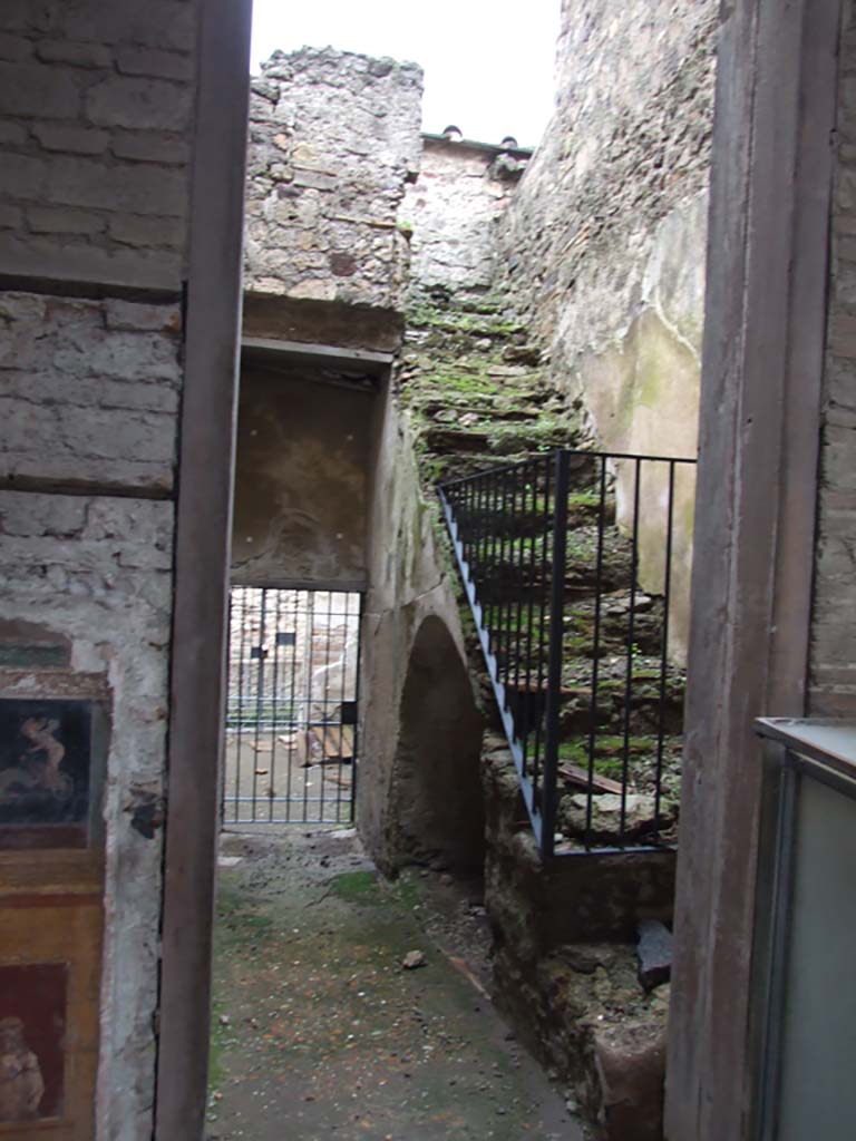 VI.15.27 Pompeii. December 2006.
Looking south from atrium of VI.15.1, towards room with steps to upper floor and corridor leading to stable entrance at VI.15.27.