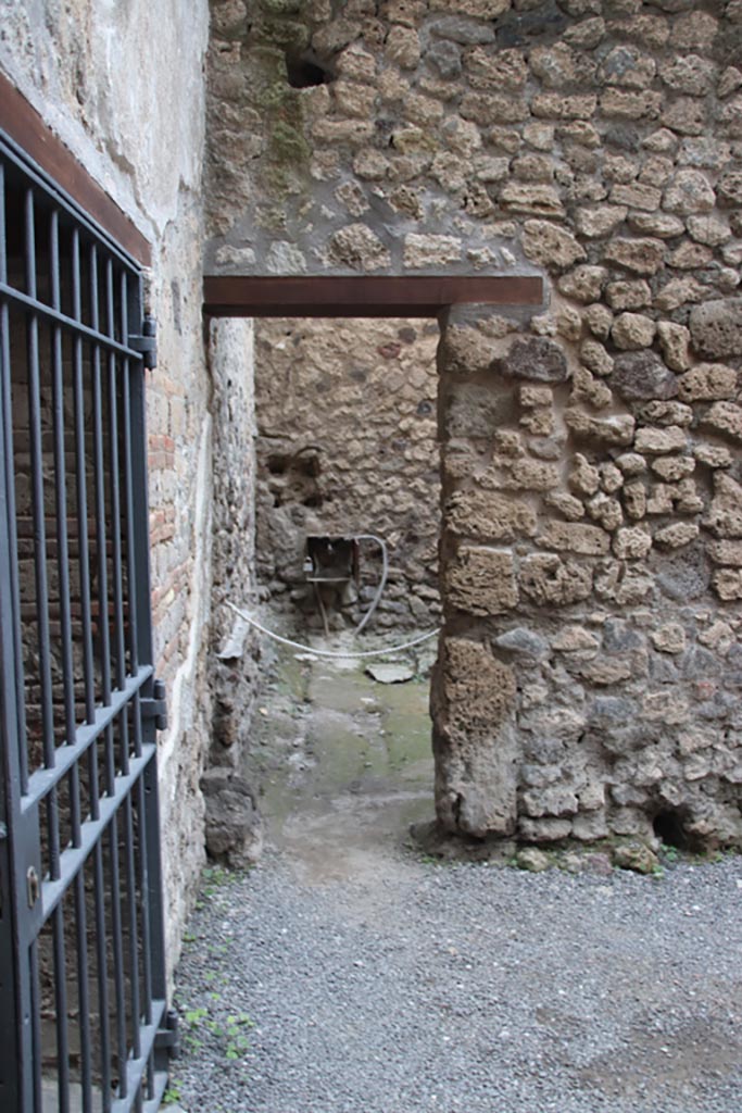 VI.15.27 Pompeii. October 2023.
Looking east towards doorway into stable. Photo courtesy of Klaus Heese.