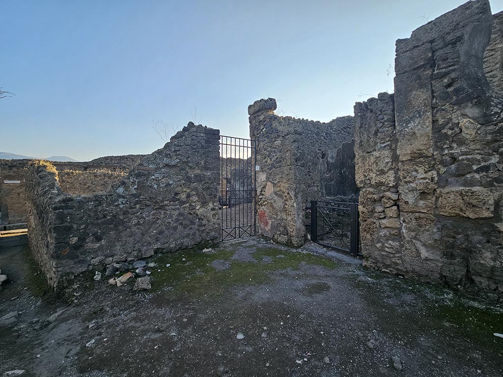 VI.16.4 Pompeii, in centre. November 2024.
Looking south-west from Via del Vesuvio towards entrance doorway, with VI.16.5, centre right. Photo courtesy of Annette Haug.