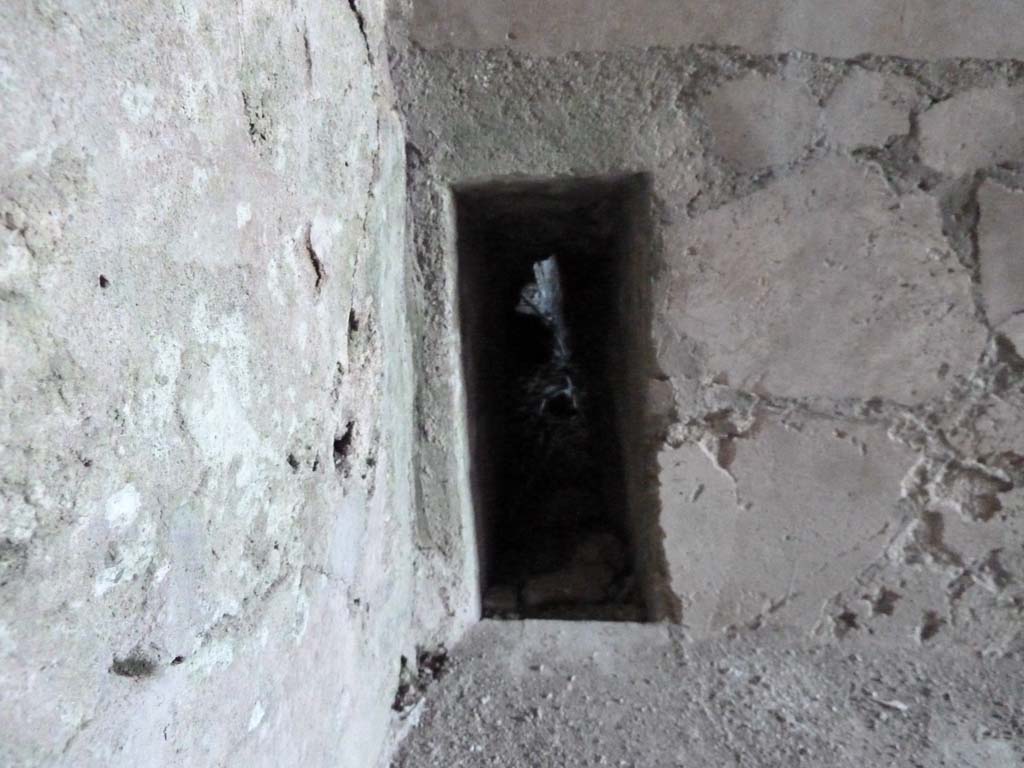 VI.16.7 Pompeii. May 2010. Room J, looking east through hole in north-east corner.