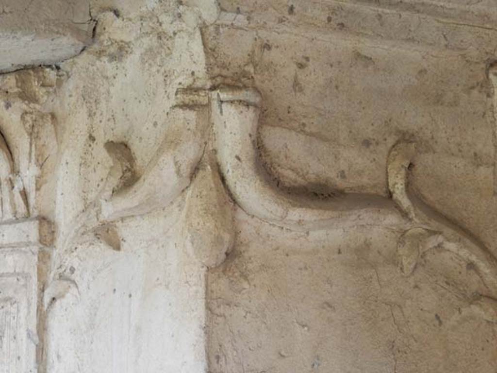 VI.16.7 Pompeii. May 2016. Room F, detail of stucco on lararium. Photo courtesy of Buzz Ferebee.