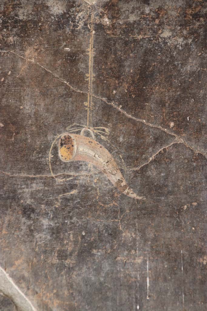 VI.16.7 Pompeii. September 2021.
Peristyle F, detail from east wall of east portico at the southern end left of the lararium.
Photo courtesy of Klaus Heese.