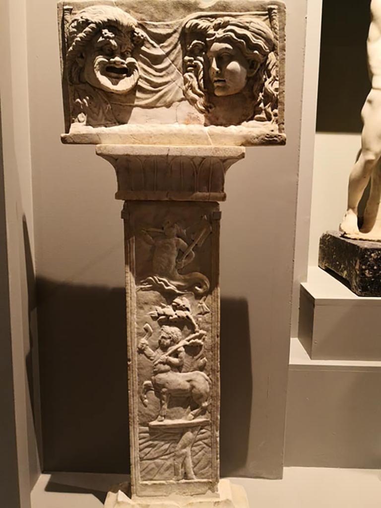 VI.16.7 Pompeii. December 2019. Marble relief with masks on a pilaster in peristyle garden.
From the exhibition “Pompei e Santorini”, Rome, 2019. Photo courtesy of Giuseppe Ciaramella.