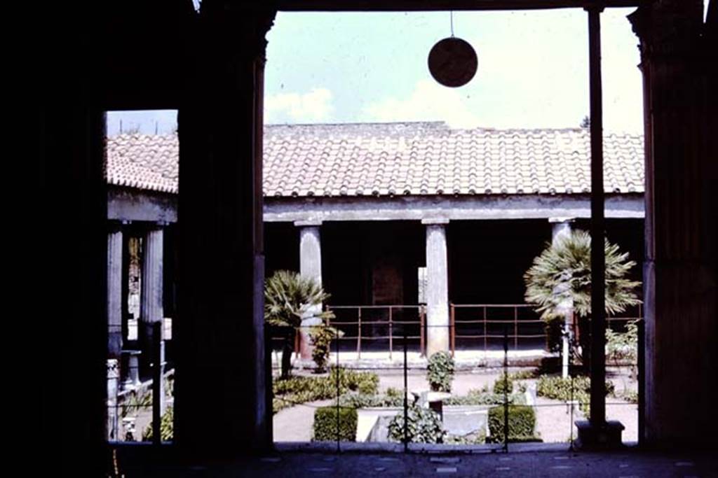 VI.16.7 Pompeii. 1964. Looking east across west portico to peristyle, from room O. Photo by Stanley A. Jashemski.
Source: The Wilhelmina and Stanley A. Jashemski archive in the University of Maryland Library, Special Collections (See collection page) and made available under the Creative Commons Attribution-Non Commercial License v.4. See Licence and use details.
J64f1873