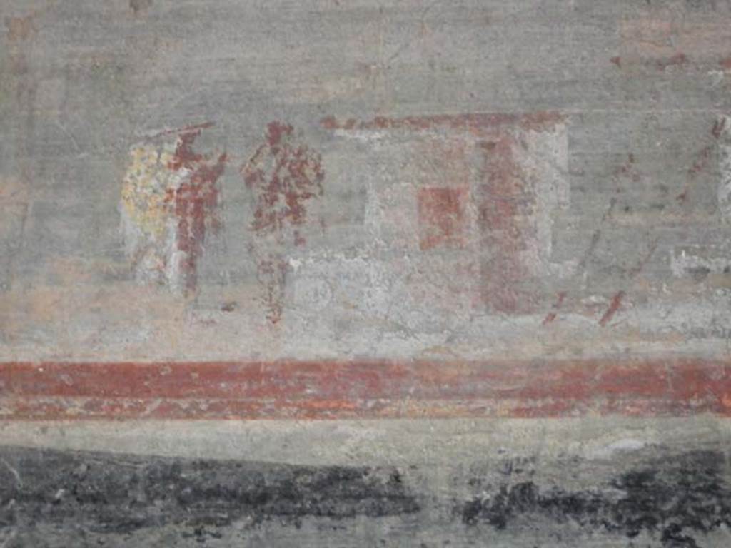 VI.16.7 Pompeii. May 2016.
Room F, detail of lower part of painting on west wall above doorway to room R. Photo courtesy of Buzz Ferebee.