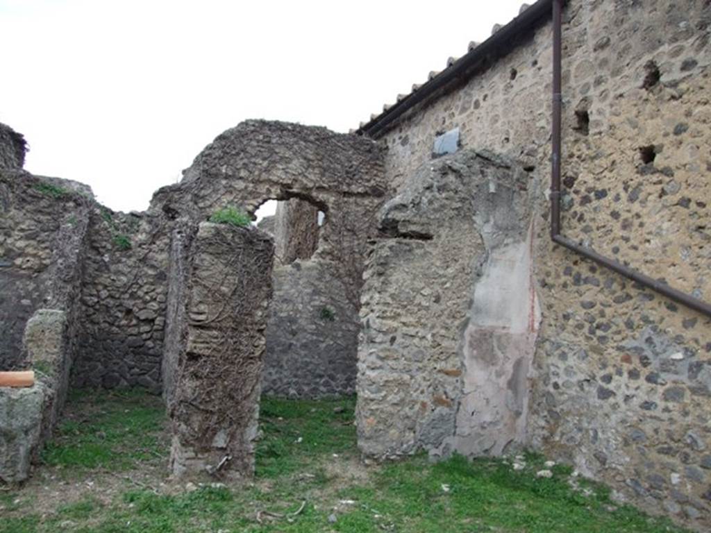 VI.16.13 Pompeii. December 2007. Doorways to rooms in north-west corner. According to NdS, on the northern wall of the workshop was a trace of the wooden staircase that led to the upper floor. This was accessed from VI.16.14. See Notizie degli Scavi di Antichità, 1908, (p.62).