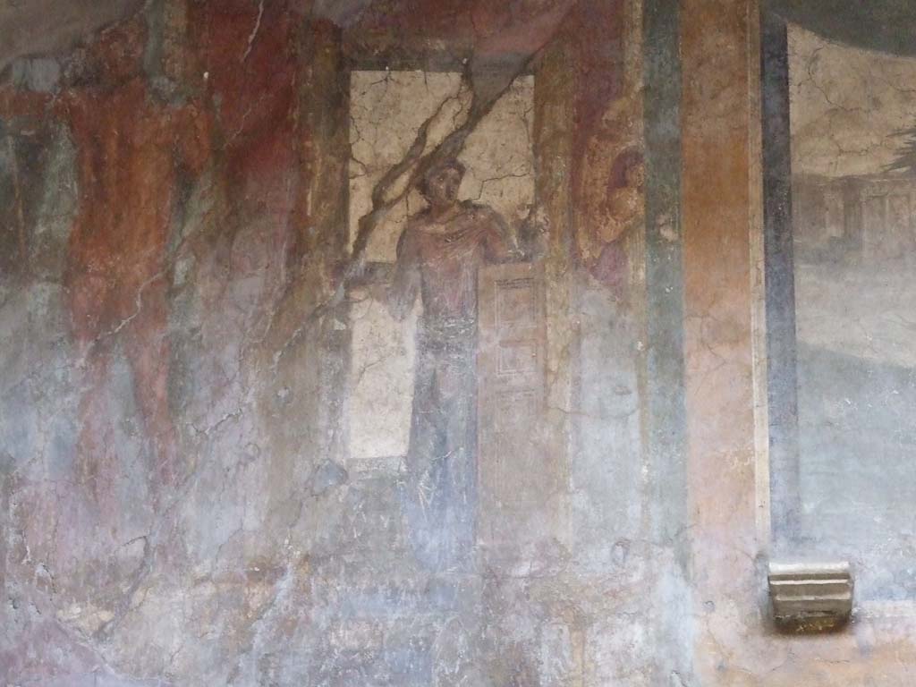 VI.16.15 Pompeii. December 2006. South end of upper west wall of atrium B above room D.
Detail of wall painting of statue of Poseidon left and woman with patera, making an offering.