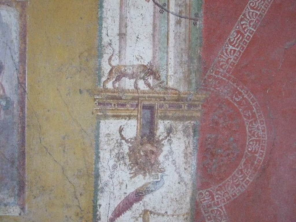 VI.16.15 Pompeii. December 2006.
North end of central painting of west wall of room F. Detail of architectural wall painting with panther, mask and peacock.