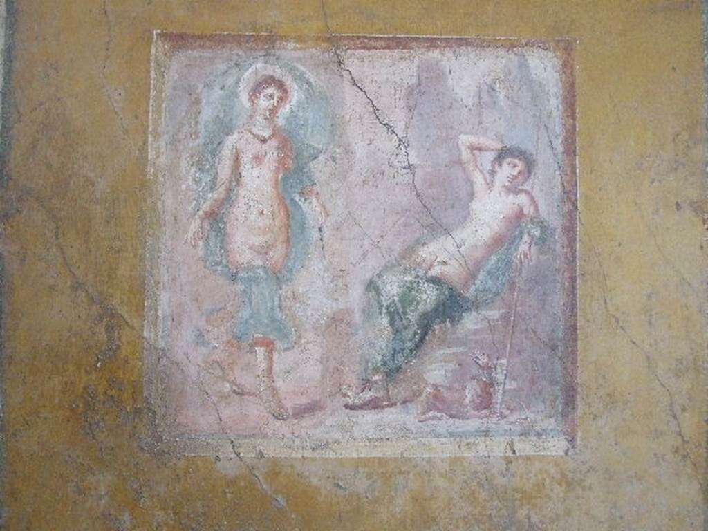 VI.16.15 Pompeii. December 2006. West wall of room F, with detail of central wall painting of Selene and Endymion. On the right was Endymion, lying on a rock, naked except for a green blanket. At the foot of the rock was a dog with a big collar, looking towards the goddess, barking. The goddess Selene comes from the left, touching the earth with the toes of her sandals. The goddess’s head was surrounded by a red nimbus with white edging. See Notizie degli Scavi, 1908, (p.73)